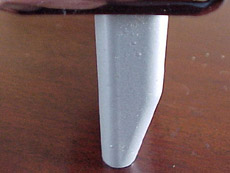 Side view of a stock Fender Block
w/ rear bevel on a Fender American Standard bridge